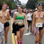Happy girls cooling off after topless marathon
