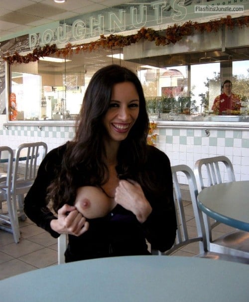 Public Flashing Pics Boobs Flash Pics  : Smiling brunette Doughnuts restaurant