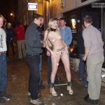 German Blonde on leash in chains surrounded by drunk guys