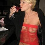 Drunk short haired blond underwear-less in ripped red dress