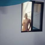 Neighbor teen blonde topless on window