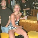 carelessinpublic:In a short dress inside a bar and showing her…