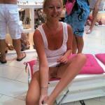 carelessinpublic:Mature lady inside a shop in a short dress and…
