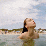 Teen comes out of the water and shows her amazing perky boobs