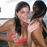 Drunk brunette flashes her cute boob on the boat