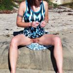 Barefoot redhead in blue dress sitting pantieless in nature