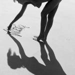 Hottie is naked writing in the sand