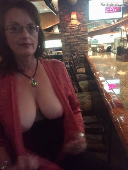 Public Flashing Pics  : Mature lady flashing really beautiful natural tits at restaurant