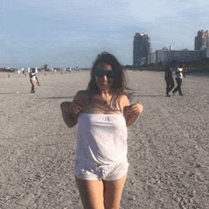 Flashing GIFS  : Round perky tits flash on beach