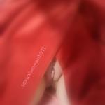 Lady in red caught while tanning her shaved pussy