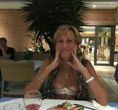 mature boobs - Slim blonde mature wife boobs out at hotel restaurant - Public Flashing Pics