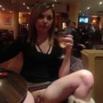 Teen drinking wine and flashing trimmed pussy at restaurant