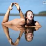 Fully nude teen girl with pigtails in water