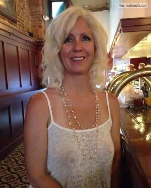 Public Flashing Pics: Mature blonde feeling sexy without bra under white tank top Mature pokies under white tank top while smiling to some hansom guy at a bar