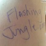 Name of our adult website written down on naked body