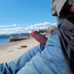 Flashing boner out of denim pants on the beach