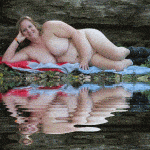 Natural woman laying nude in nature