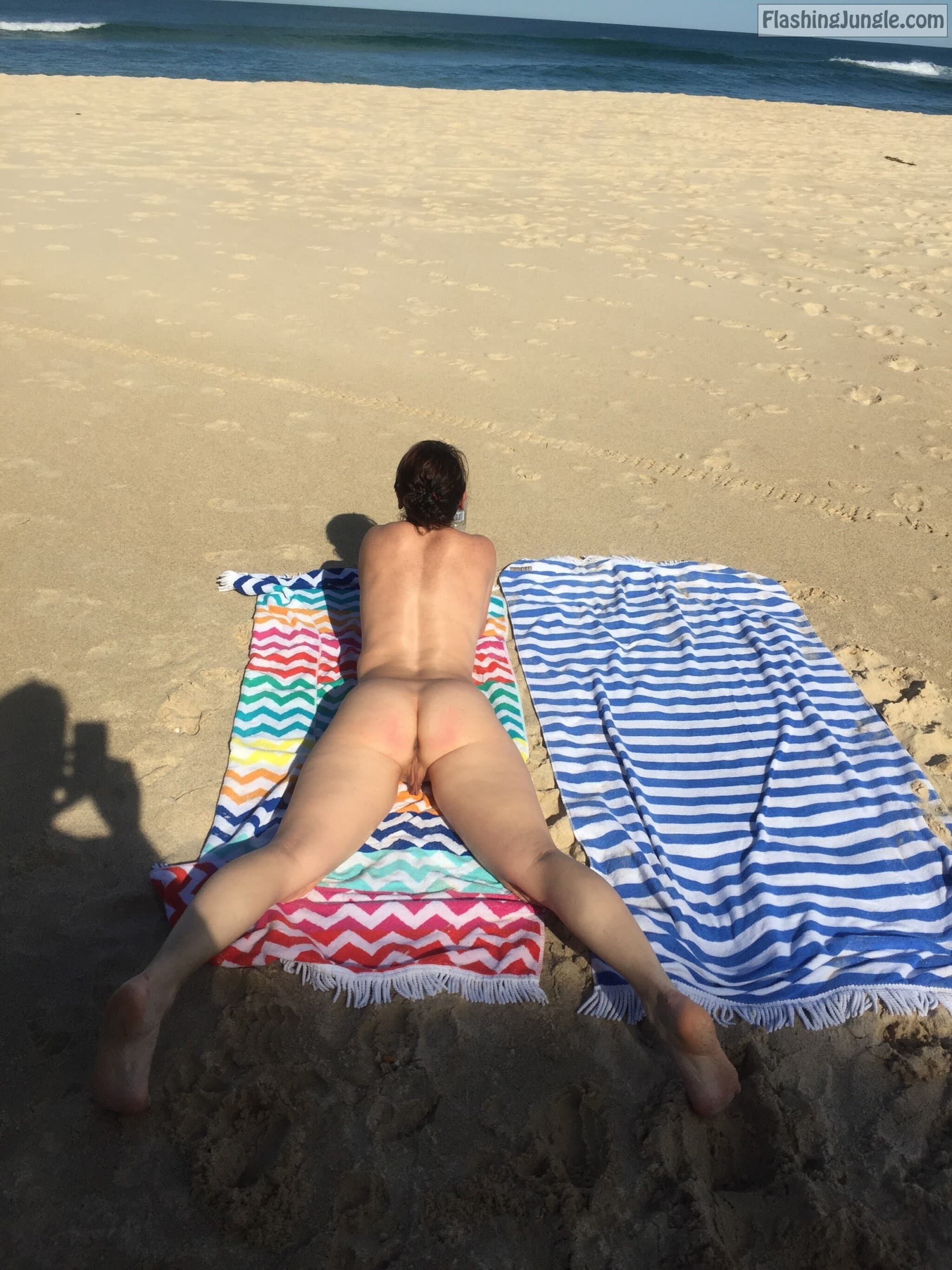 Hotwife Pics: Sharing nude wife on public beach Wife with very sexy slim body is laying on a public beach while hubby is taking photos of her fuckable ass and pussy. nude wife beach pics wife beach nude pics
