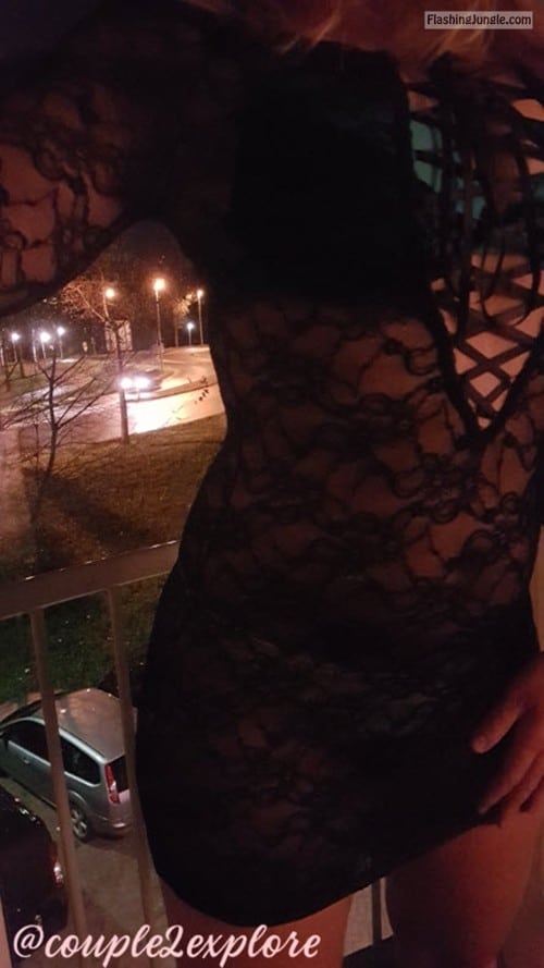 Real Amateurs Public Flashing Pics  : Posing on balcony in provocative see through black dress I love to show off in public