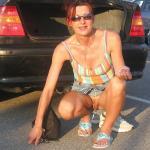 Mature slut flashing cunt on car parking