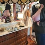 Big round natural mature tits on display in the shop