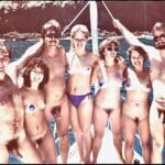 A crowd of nudists hang out on a yacht