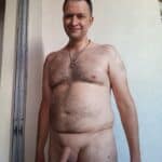 Mature guy is taking a naked selfie