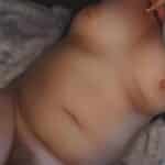 Naked chubby girl on a bed