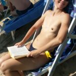 Reading on the beach arouses nipples