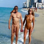 Naked couple is flashing at the beach