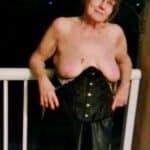 Granny is flashing her old tits