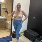 She’s Confidently Bared Her Breasts in the Bathroom Mirror