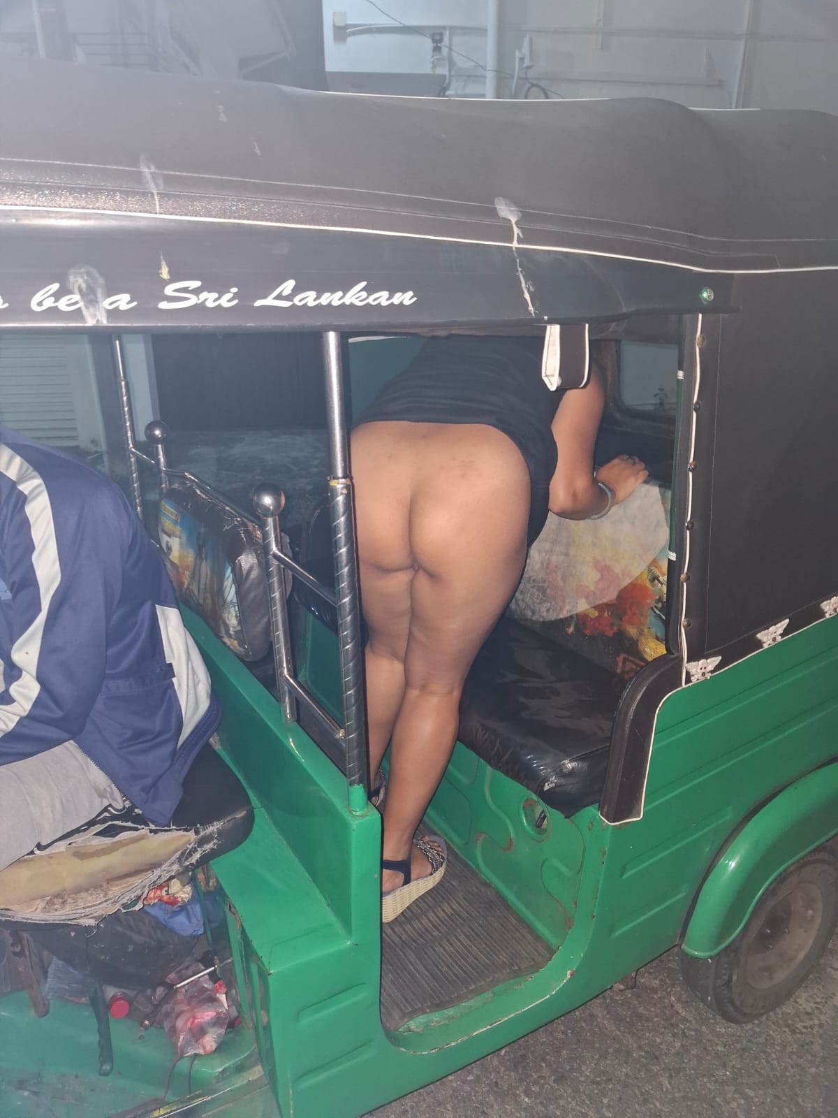 nipple accidentally exposed in public pics - Rickshaw Rendezvous: A Public Flash of Thighs A green auto rickshaw in Sri Lanka captures a casual, explicit moment with exposed thighs and personal belongings scattered inside. - Ass Flash Pics