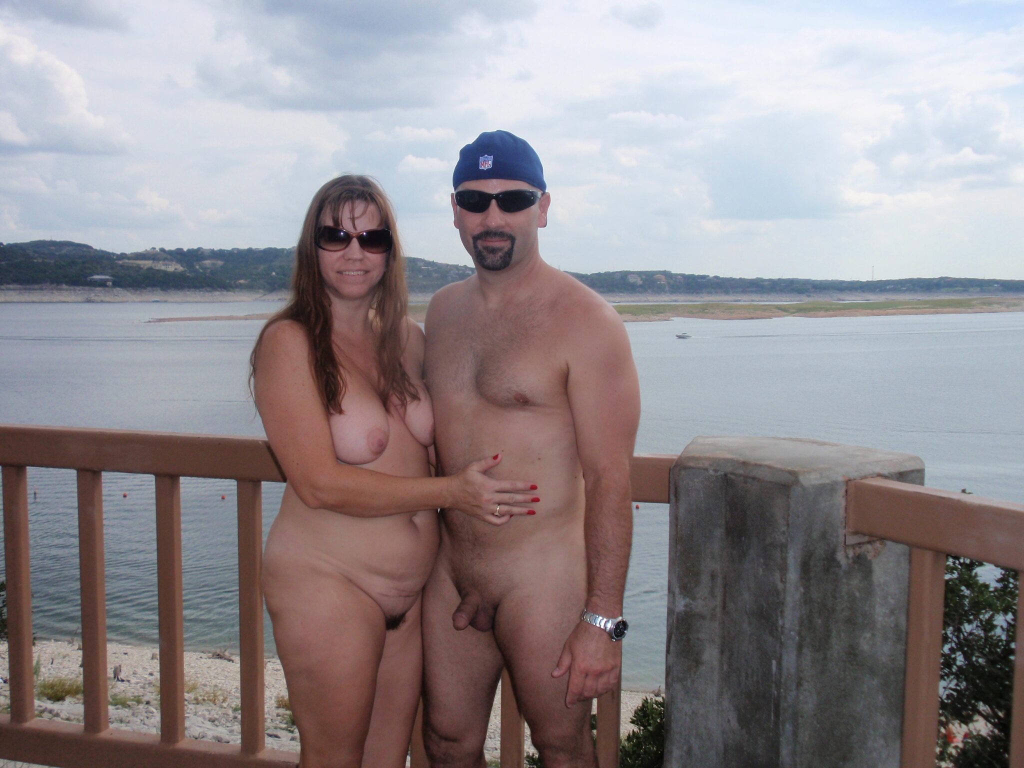 jb nude swim pics - Hippie Hollow: Naked Couple by the Water A nude couple stands confidently at Hippie Hollow, embracing public nudity with natural ease. The setting offers a serene backdrop, enhancing the casual, uni... - Nude Beach Pics