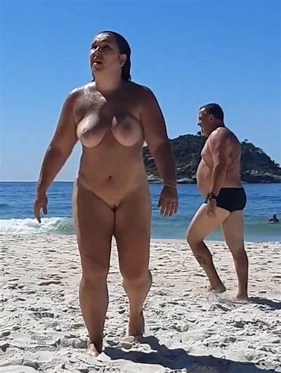 nollywood boobs picture sex - Sunny Beach Encounter: Nude Woman and Voyeuristic Man A nude woman stands confidently on a sunny beach, her laughter echoing as a man in briefs watches from behind, creating a charged atmosphere of voyeurism and... - Bitch Flashing Pics