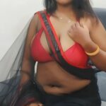 Mature MILF Sabita Pattnaik Flashes Cleavage in Black Saree