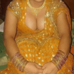 Mature MILF’s Tease: Cleavage on Display in Traditional Attire