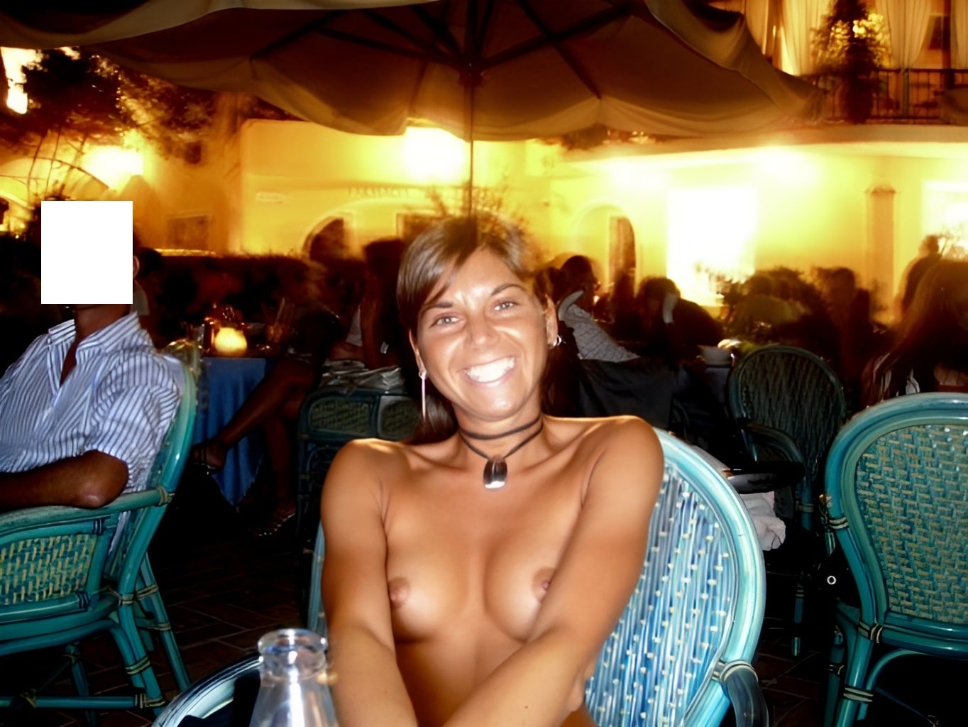 Bitch Flashing Pics: Curvy MILF Flashes Her Assets Under the Stars A confident MILF flashes her assets on a night patio, drawing attention with her natural curves and unapologetic nudity.