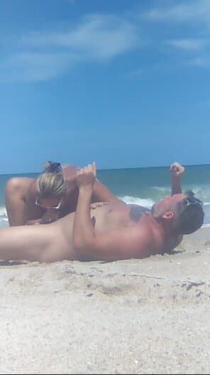 white top see through nipples nude - Public Passion: Beach Sex Unleashed A blonde woman rides a muscular man on a public beach, their naked bodies glistening under the sun. The scene captures raw, unfiltered passion amidst the oce... - Nude Beach Pics