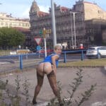 Mature MILF Flashes Her Shaved Pussy on Urban Street Corner