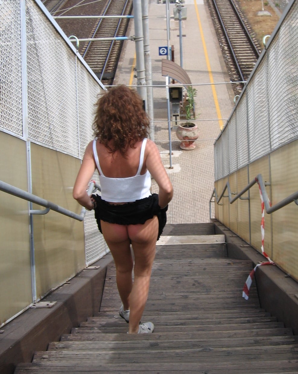 beach bikini porn pics - Who’s That Bitch Flashing Her Ass in the Railway Station? A woman in a railway station flashes her ass, wearing low-riding shorts and a midriff top, fully visible to the public. Her confidence and disregard for the ... - Ass Flash Pics