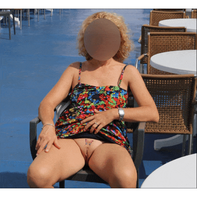 benin xxx hot pics - Poolside Flash: Butterfly Tattoo Reveal A woman flashes her butterfly tattooed pussy poolside, seated confidently with legs spread, showcasing her shaved pussy and curvy figure in a public setting. - Bitch Flashing Pics