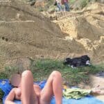 Who’s Watching Her Spread Eagled on the Beach?