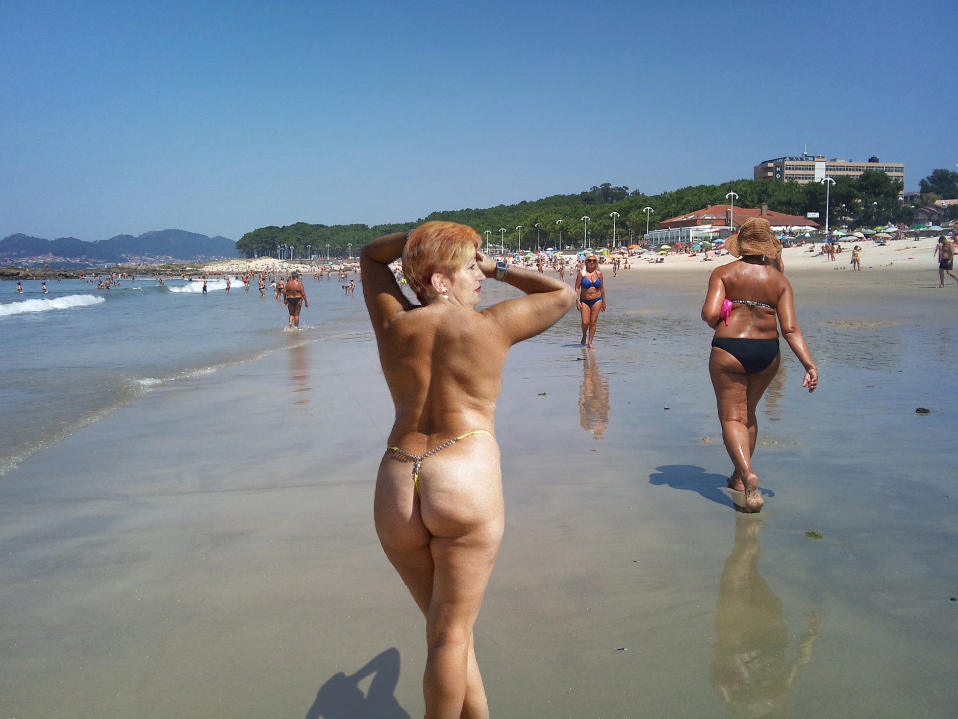 Ass Flash Pics: Hotwife’s Beach Display: Ass Out, Eyes On A hotwife flaunts her ass in a yellow thong at Samil Beach, drawing attention with her confident pose and exposed body. Her companion, unaware, walks ahead i...