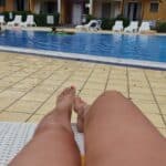 Poolside Tease: Hotwife Sunbathing