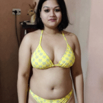 Mature MILF Flashing Her Curves in Yellow Bikini