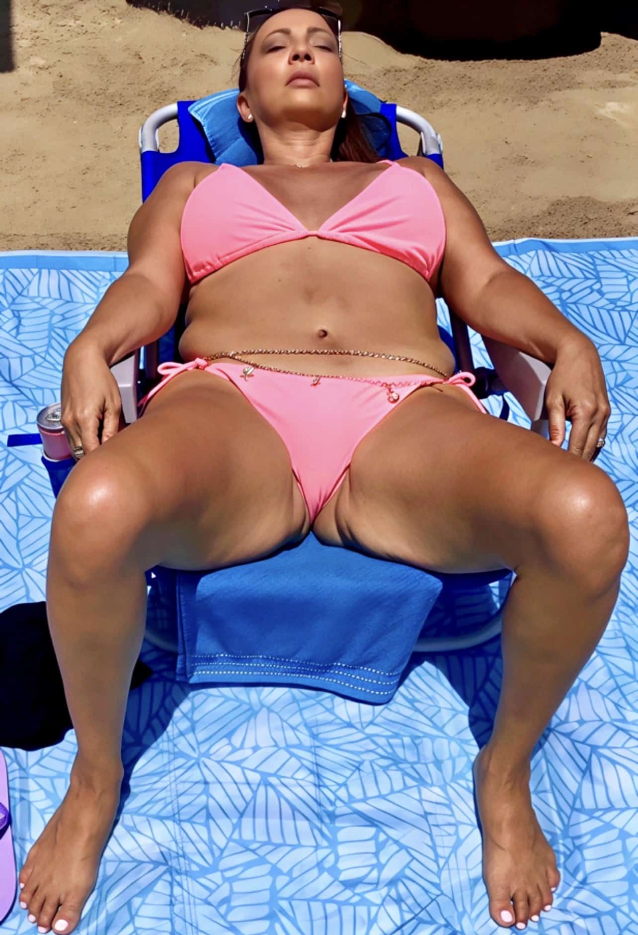 sudan xxx picture - Beachside Beauty: A MILF’s Relaxing Afternoon A MILF enjoys a peaceful afternoon on the beach, her curves accentuated by a pink bikini, a gold chain belt, and the sun's warm embrace. - Hotwife Pics