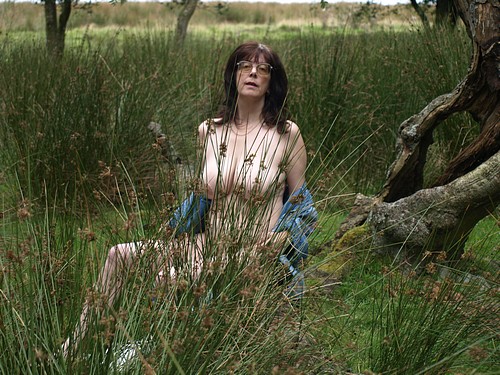 upskirt pussy pics - Mature MILF Flashes Her Boobs in Public Mature MILF flashes her boobs in public, sitting in tall grass with her shirt open, exposing her torso and genitals. - Boobs Flash Pics