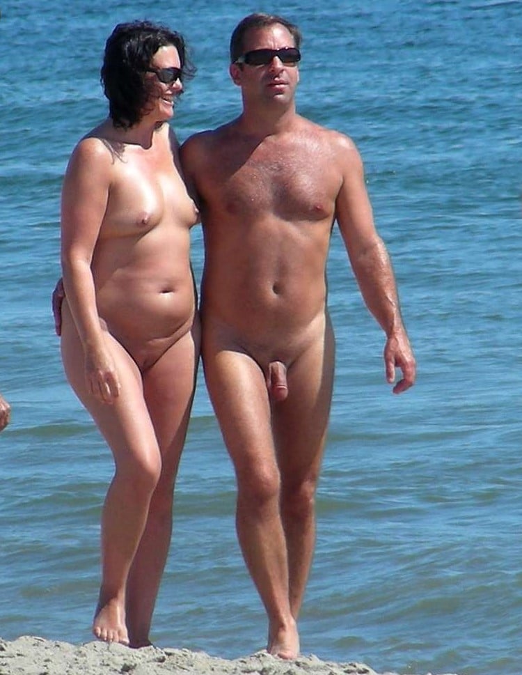 sex phot big body milk balck girl - Couple Enjoying Nude Beach Day A couple stands nude on a beach, enjoying the sun and water. No sexual activity, just natural nudity in a public setting. - Hotwife Pics